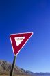 yield sign at the blue sky
