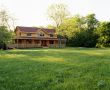 Log House with green grass