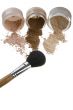 Cosmetics and brushes for a make-up on a light background