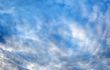 Plumose clouds in the dark blue sky