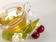 breakfast still-life. green tea with cherry and fresh jasmine