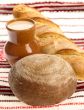 Delicious bread on traditional peasant textile background