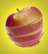 sliced apple on yellow background