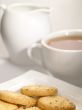 tea cup with cookies on the plate