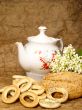 Delicious peasant bread with teapot and flowers