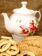 Delicious peasant bread with teapot and crisp