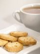 tea cup with cookies on the plate