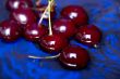 cherry on blue close up