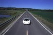 Carefree Convertible Driving Down Open Road