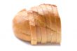 Cutting white bread closeup