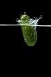Cucumber in water on black macro