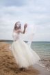 	beautiful bride  dancing on the beach