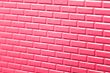 Wall of metallic bricks