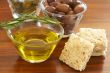 Two jars of green and black olives and croutons