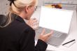 Excited Woman In Kitchen Using Laptop with Blank Screen