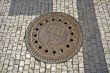 Sewer manhole with emblem of Prague
