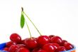 Cherries with green leaf