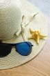 Hat, sunglasses and shells