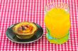 glass of orange juice and cake