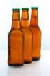 Three beer bottles abreast