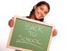 Pretty Hispanic Girl Holding Chalkboard with Back To School