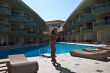 The beautiful model poses near pool