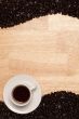 Dark Roasted Coffee Beans on Wood Background