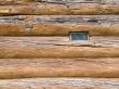 Window in house built from tree