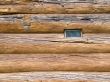 Window in house built from tree