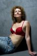 woman in brassiere on grey