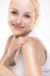 young beautiful girl applying cream