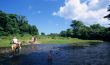 Horse riding crossing a river  in Dominican republic