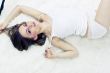 Young woman laying bed