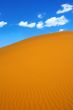 sand dunes and cumulus clouds