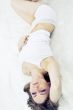 Young woman laying bed
