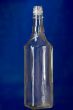 Empty glass bottle on blue