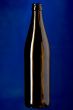 Glass bottle on blue closeup