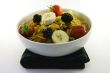 Cornflakes and Fruit in a White Bowl