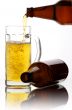 Beer flows from a glass bottle2