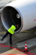 Engineer inspecting aircraft engine