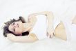 Young woman laying bed