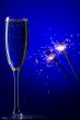champagne and sparkles on blue