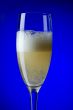 champagne glasses on blue closeup