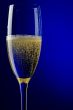 champagne glasses on blue macro