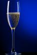 champagne glasses on blue