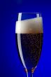 On blue champagne glasses close up