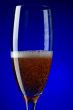 On blue champagne glasses macro
