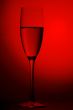 On red background champagne glasses