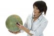 young doctor with stethoscope and globe