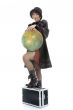 Beautiful brunette with valise and globe